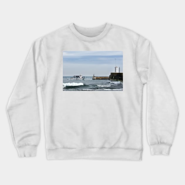 Tour boat returning from the Farne Islands to harbour, Northumberland, UK Crewneck Sweatshirt by richflintphoto